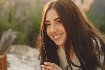 Woman with long, healthy hair smiling