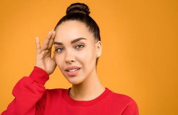 Woman wearing a quick top bun