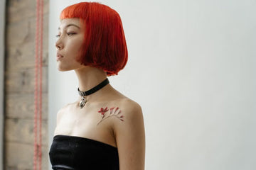 Woman with a vivid red-orange bob