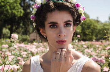 Woman with flowers in her hair among spring blossom