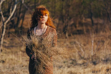 Woman with long hair in an autumn field