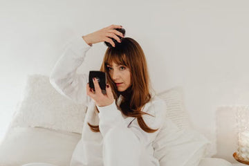 Woman brushing through her hair to detangle it