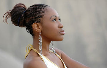 Woman with her braids gathered into a neat updo