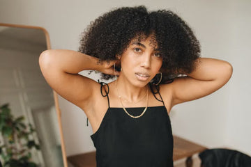 Woman caring for her natural afro hair