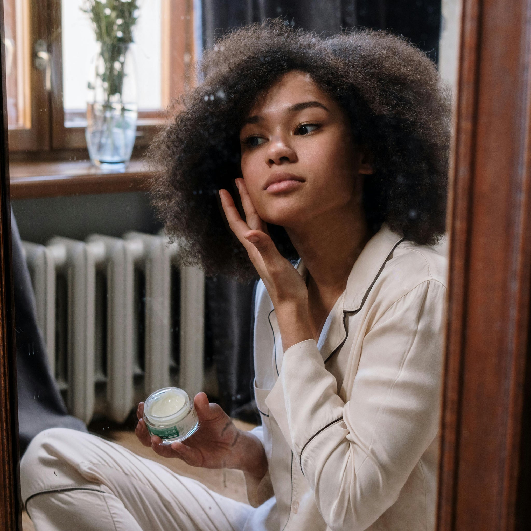 girl-applying-skincare-products