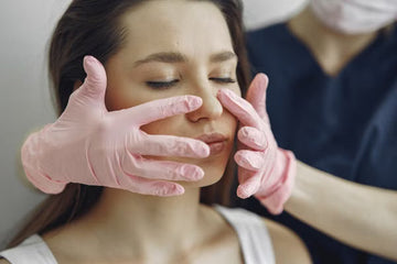 Woman receiving a facial massage at a spa