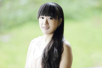 Smiling woman with long, healthy dark hair