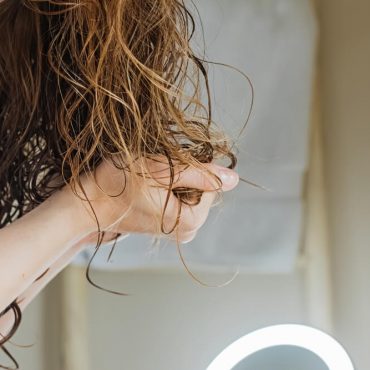 woman styling hair